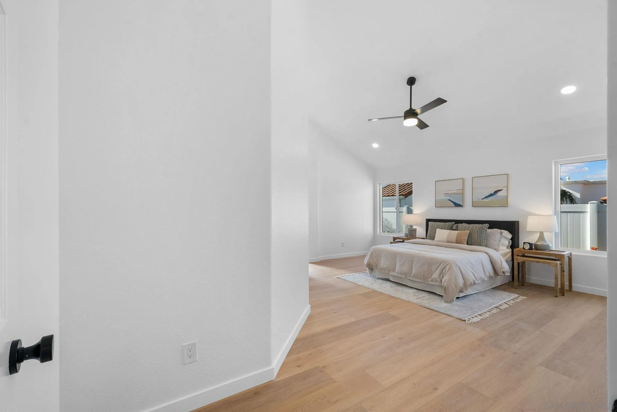 4975 Delos Way Oceanside, CA 92056 - Photo 16 of 31 a spacious bedroom with a bed and window