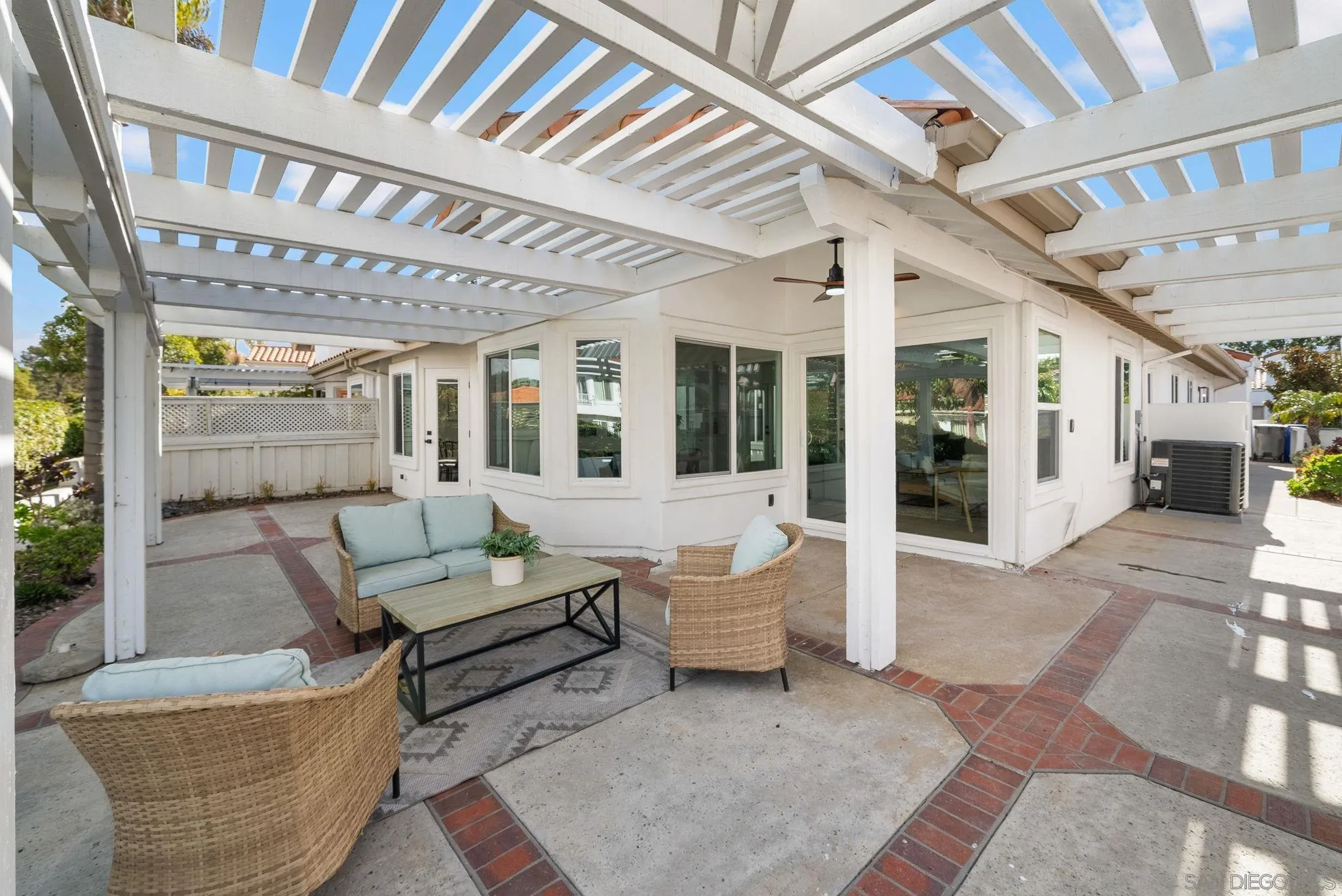 4975 Delos Way Oceanside, CA 92056 - Photo 26 of 31 a living room with furniture and a chandelier