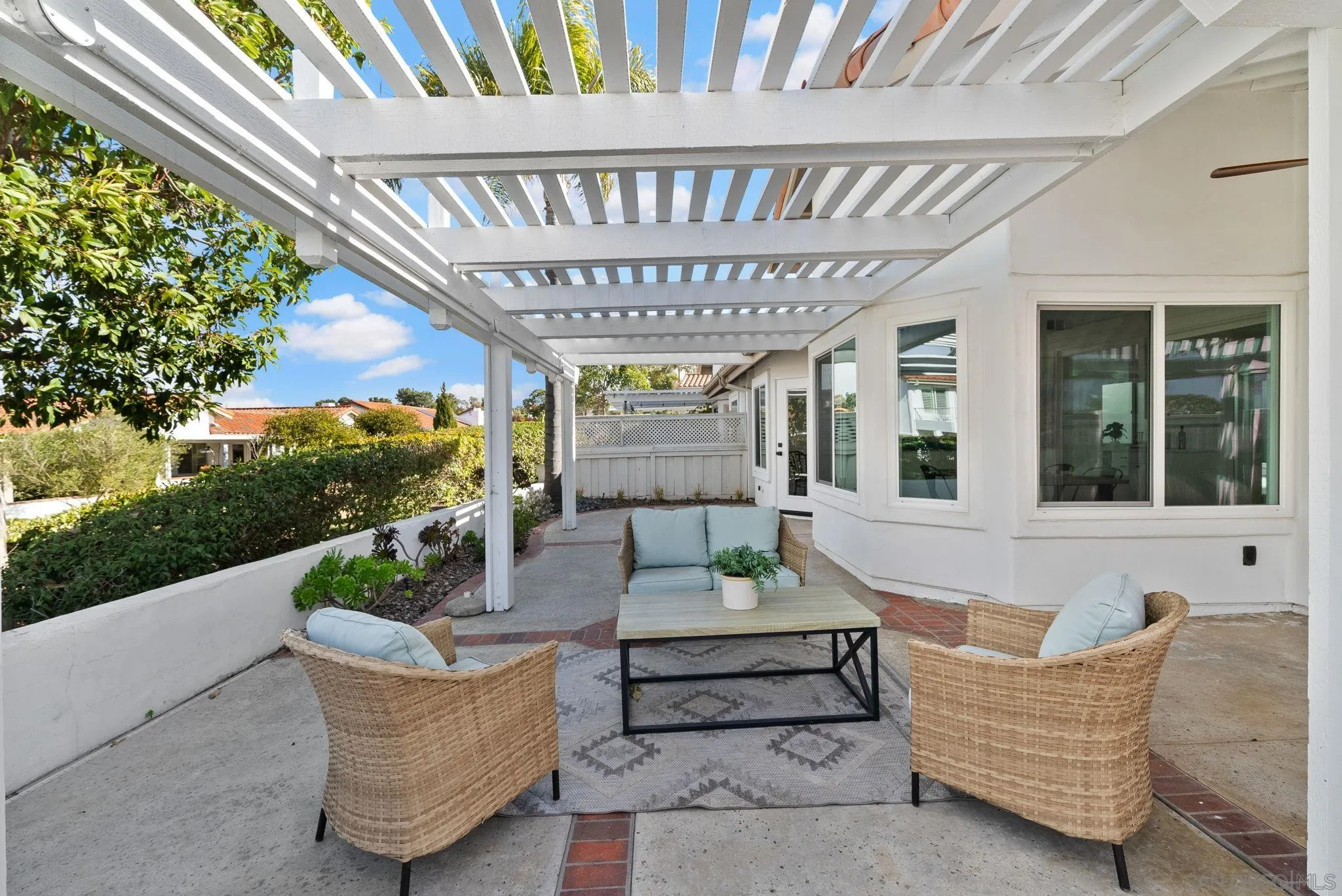 4975 Delos Way Oceanside, CA 92056 - Photo 27 of 31 a balcony with furniture and a potted plant