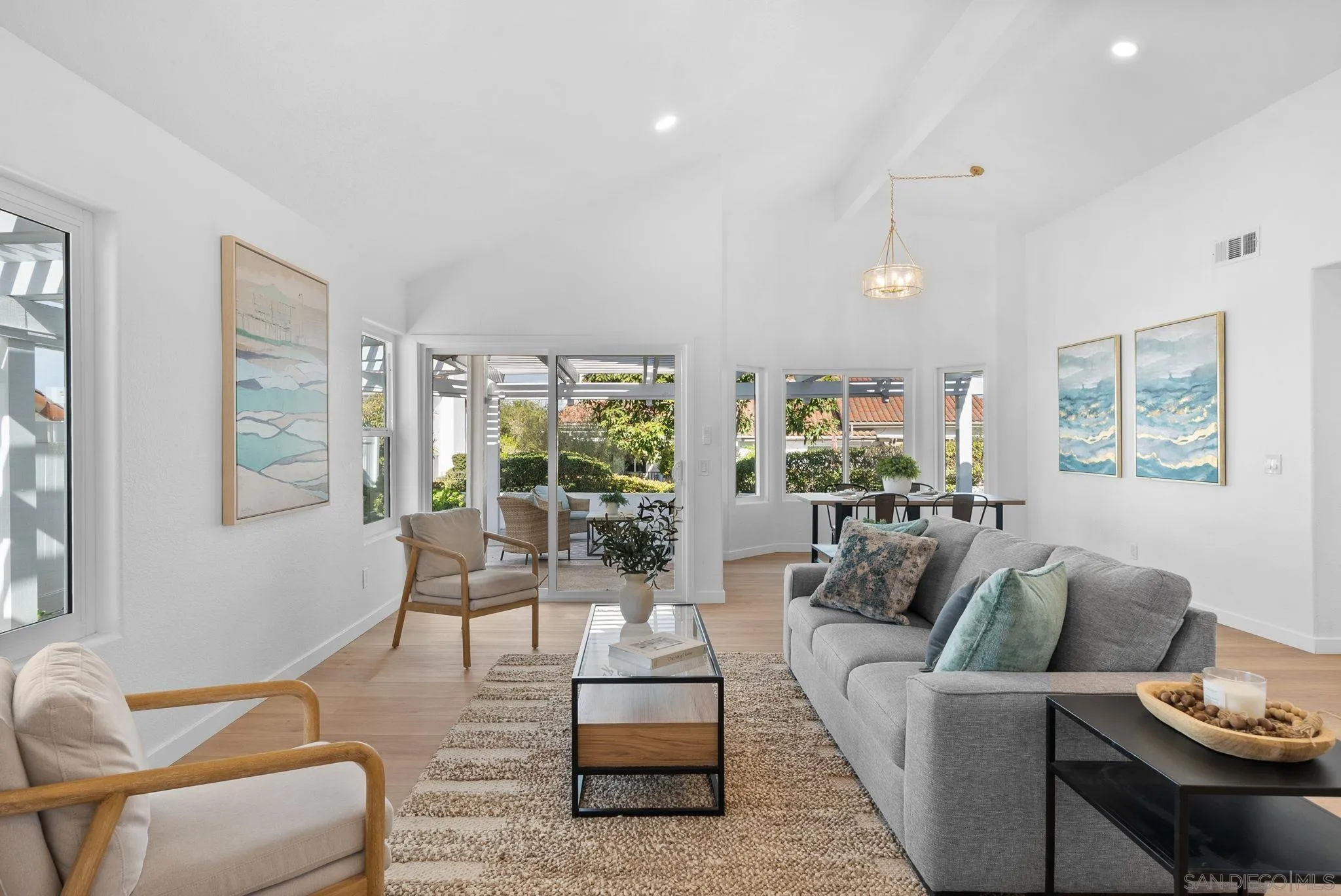 4975 Delos Way Oceanside, CA 92056 - Photo 3 of 31 a living room with furniture and a large window