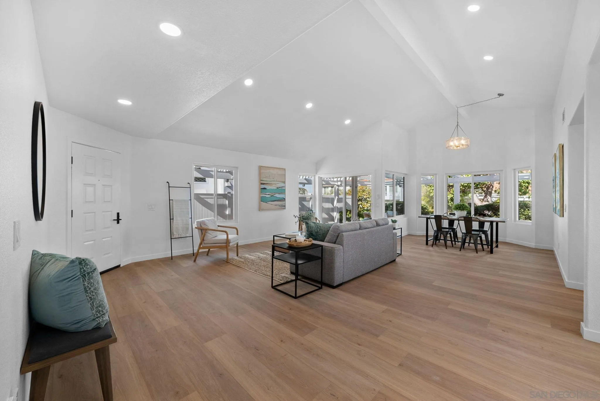 4975 Delos Way Oceanside, CA 92056 - Photo 4 of 31 a living room with furniture and wooden floor