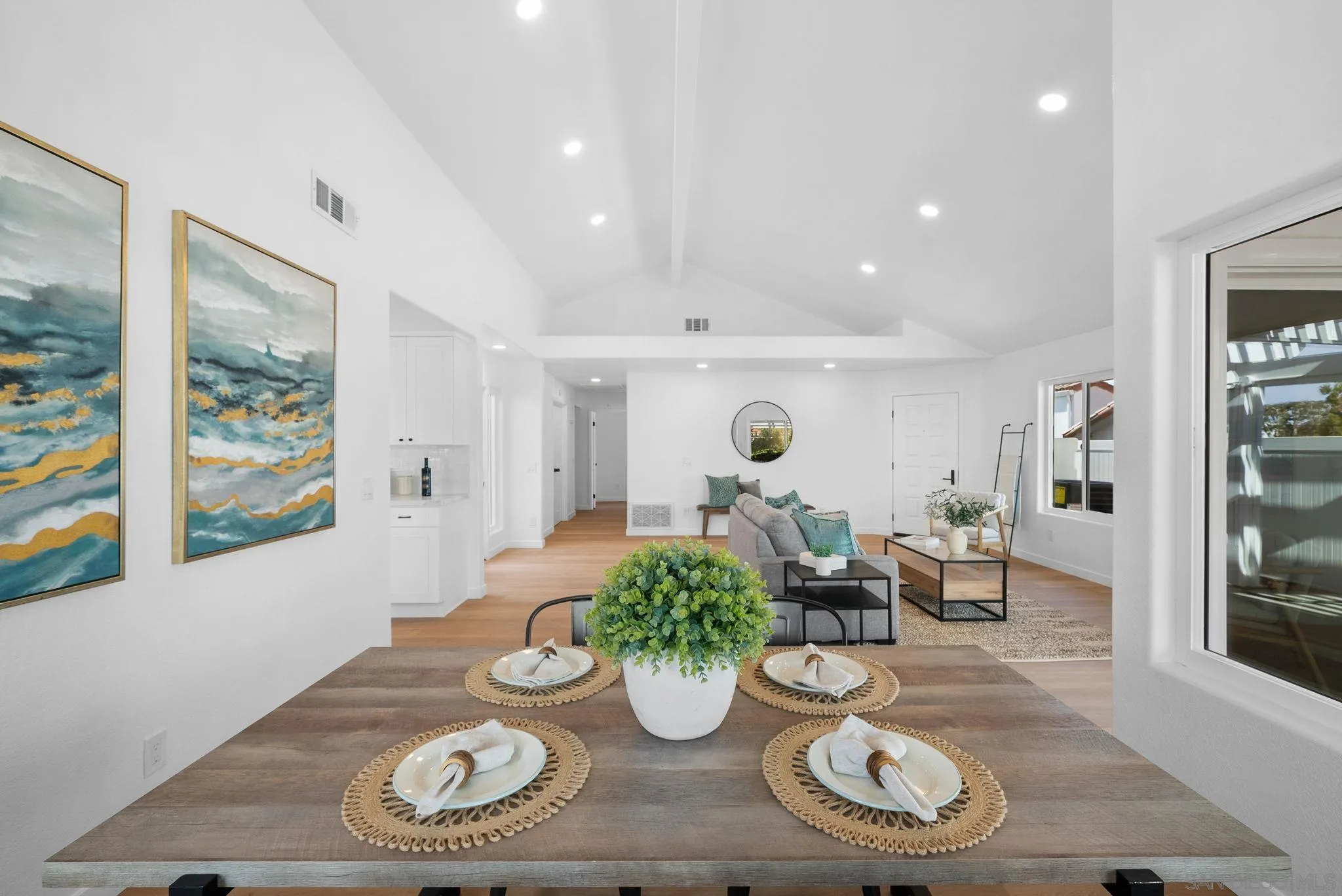 4975 Delos Way Oceanside, CA 92056 - Photo 7 of 31 a dining room with lots of furniture and wooden floor