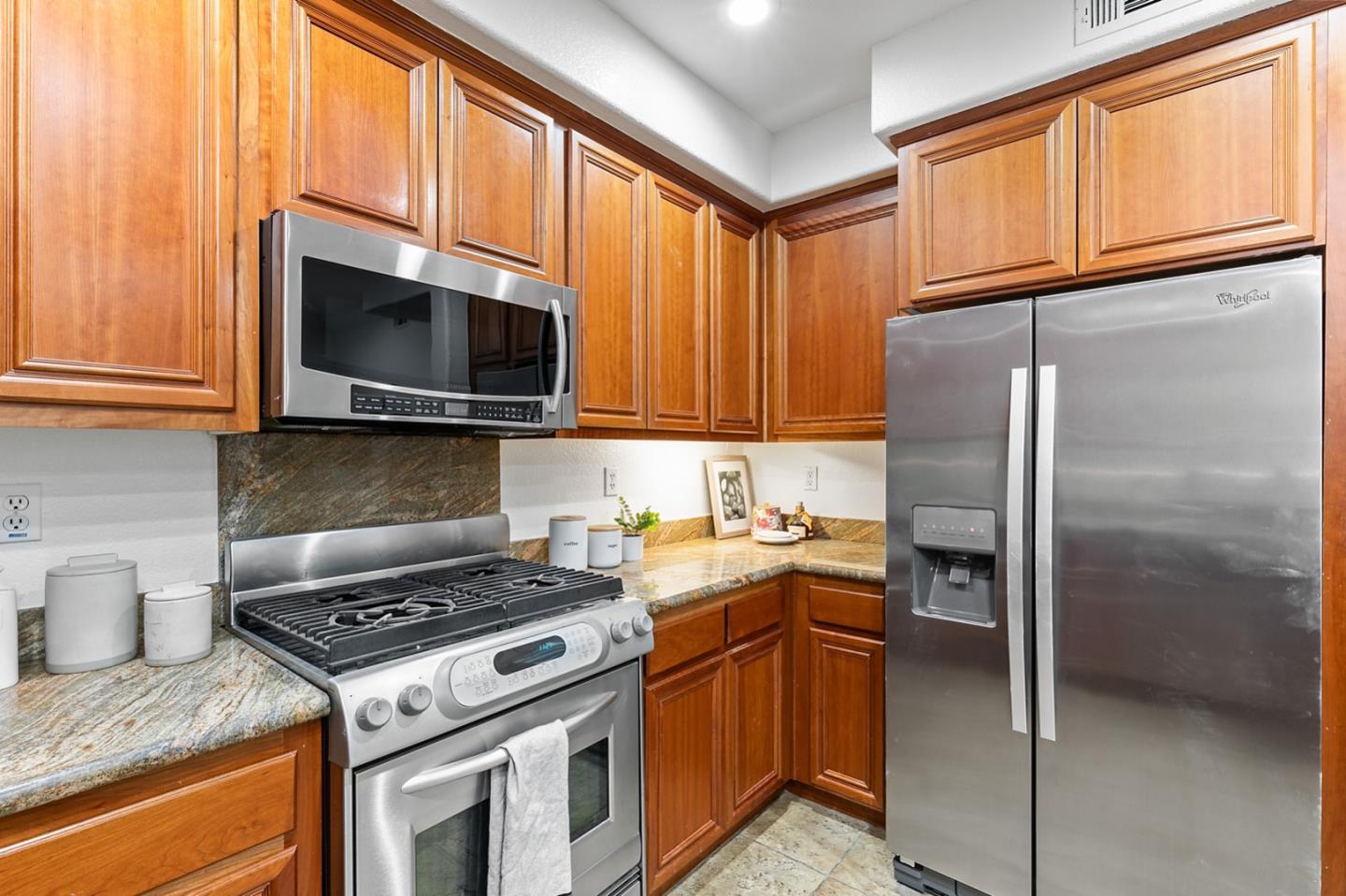 66 Parc Pl Drive Milpitas, CA 95035 - Photo 10 of 34 a kitchen with a stove microwave and refrigerator
