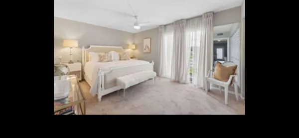 a bedroom with a bed and a mirror