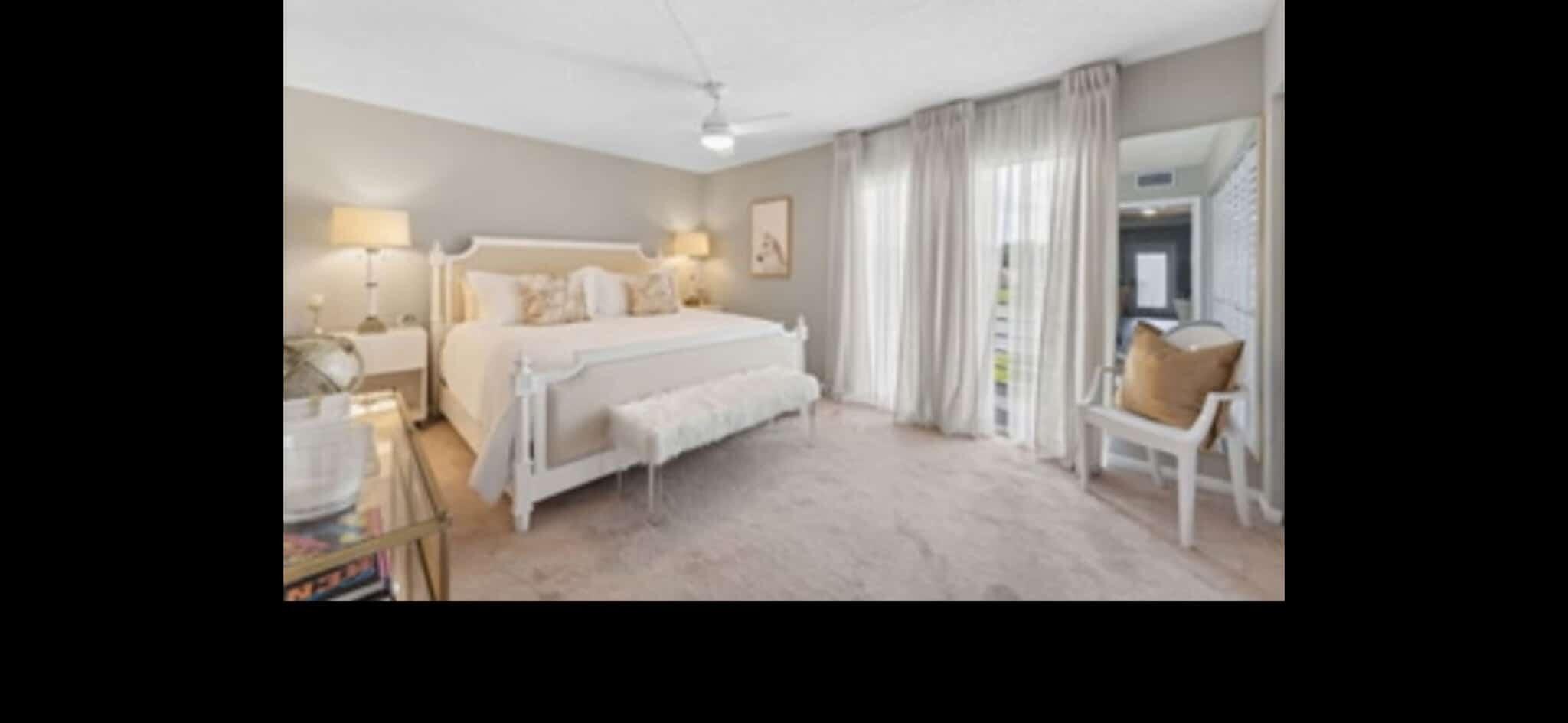 321 Dorset Drive Boca Raton, FL 33434 - Photo 4 of 6 a bedroom with a bed and a mirror