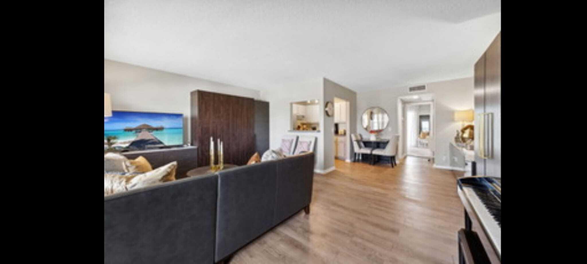 321 Dorset Drive Boca Raton, FL 33434 - Photo 6 of 6 a living room with furniture and a large window