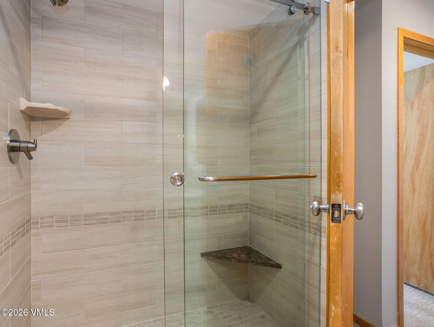 1100 North Frontage Road West, Unit 1503 Vail, CO 81657 - Photo 18 of 32 a bathroom with a shower