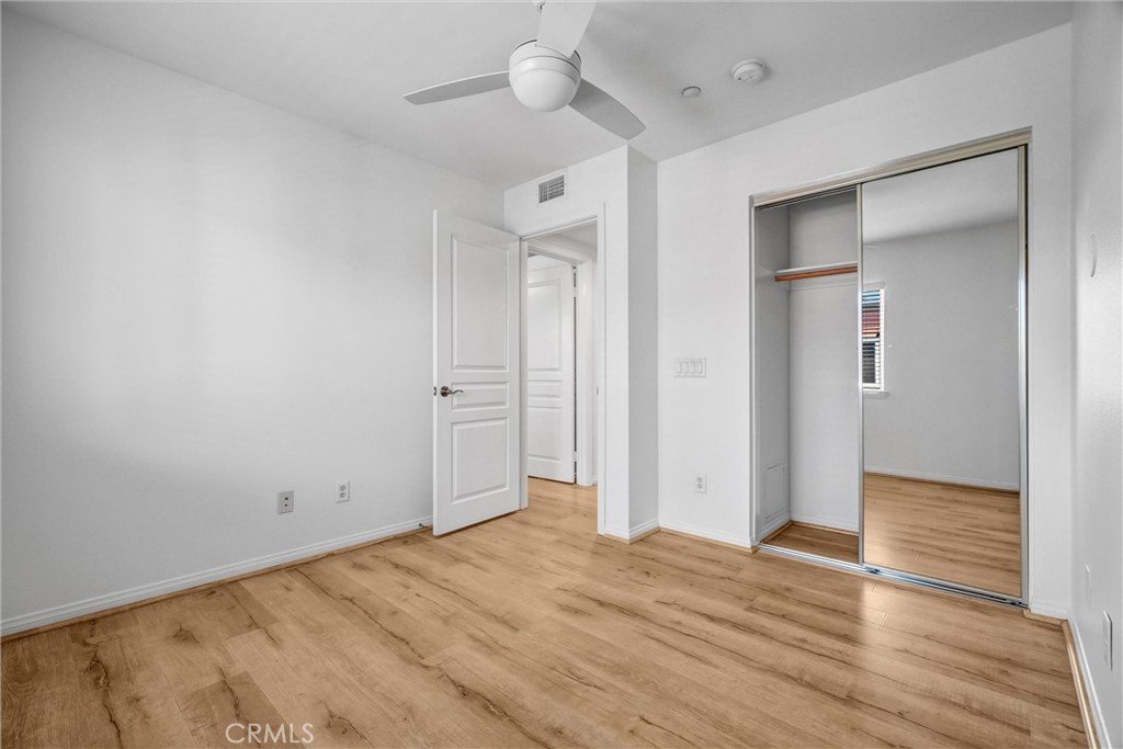 12 Shellprint Court Newport Beach, CA 92663 - Photo 29 of 42 Bedroom #2 with Mirrored Wardrobes and Ceiling Fan