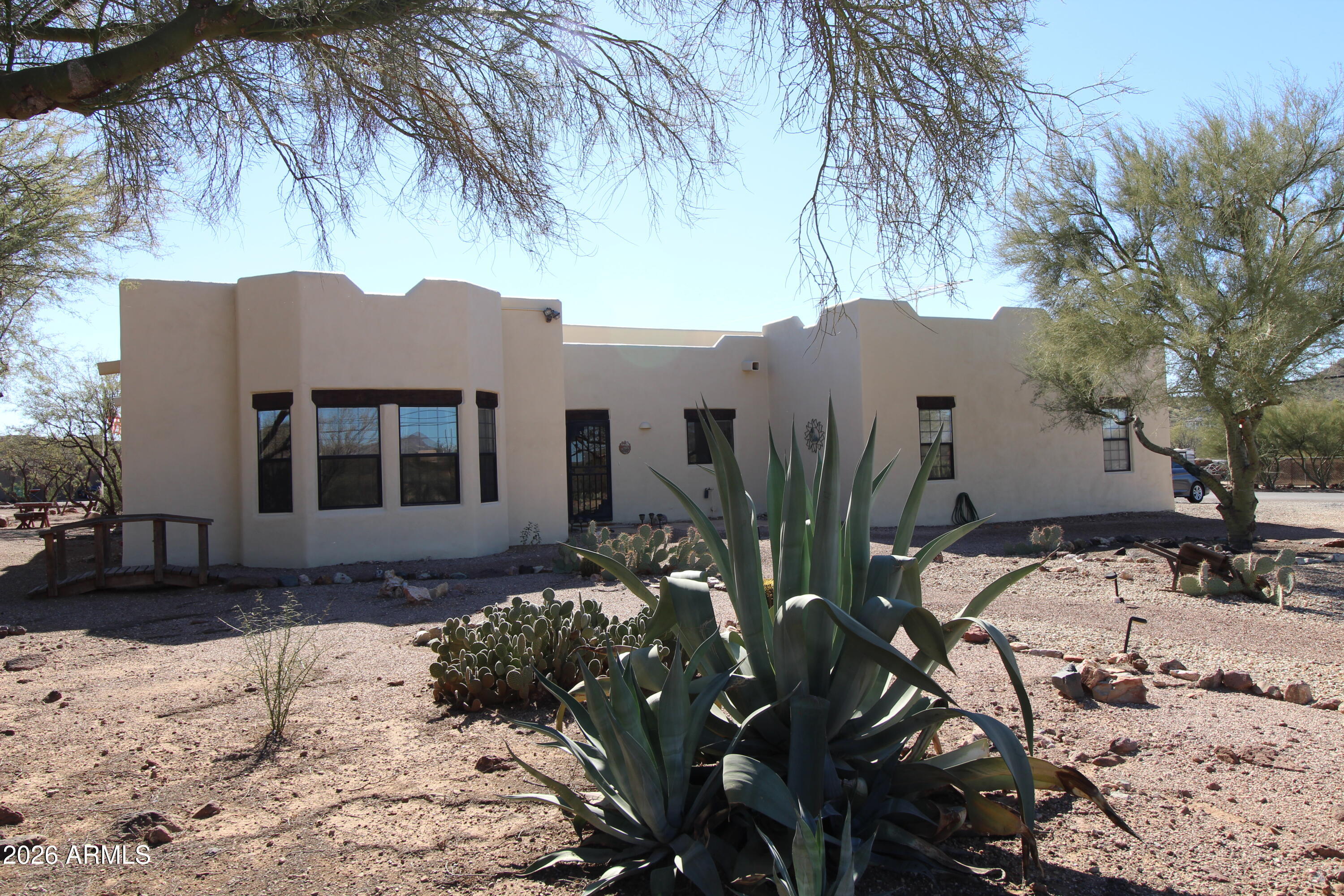 1405 East Circle Mountain Road New River, AZ 85087 - Photo 1 of 40 a view of a house with a yard covered in snow