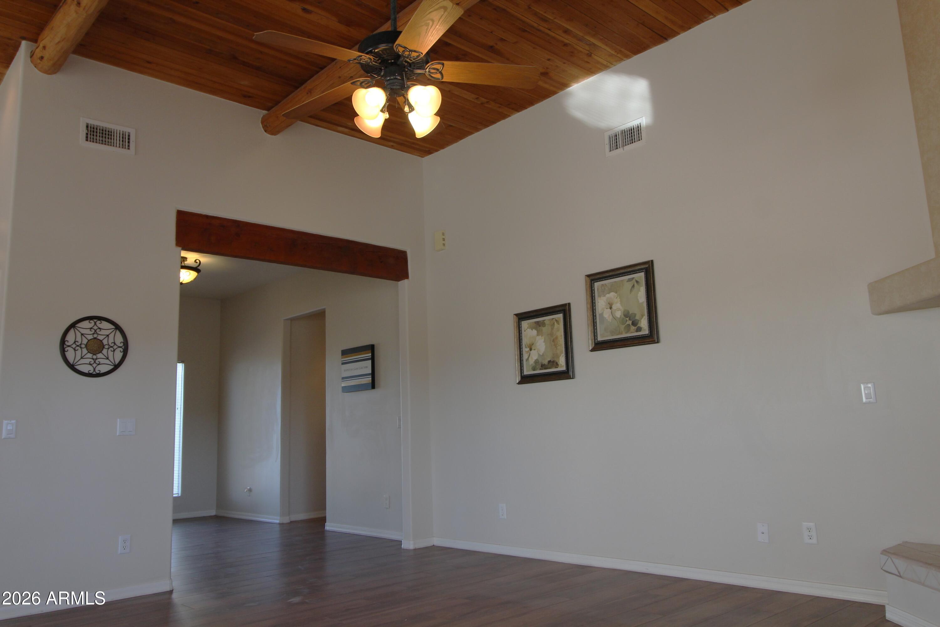1405 East Circle Mountain Road New River, AZ 85087 - Photo 19 of 40 a view of a livingroom with wooden floor