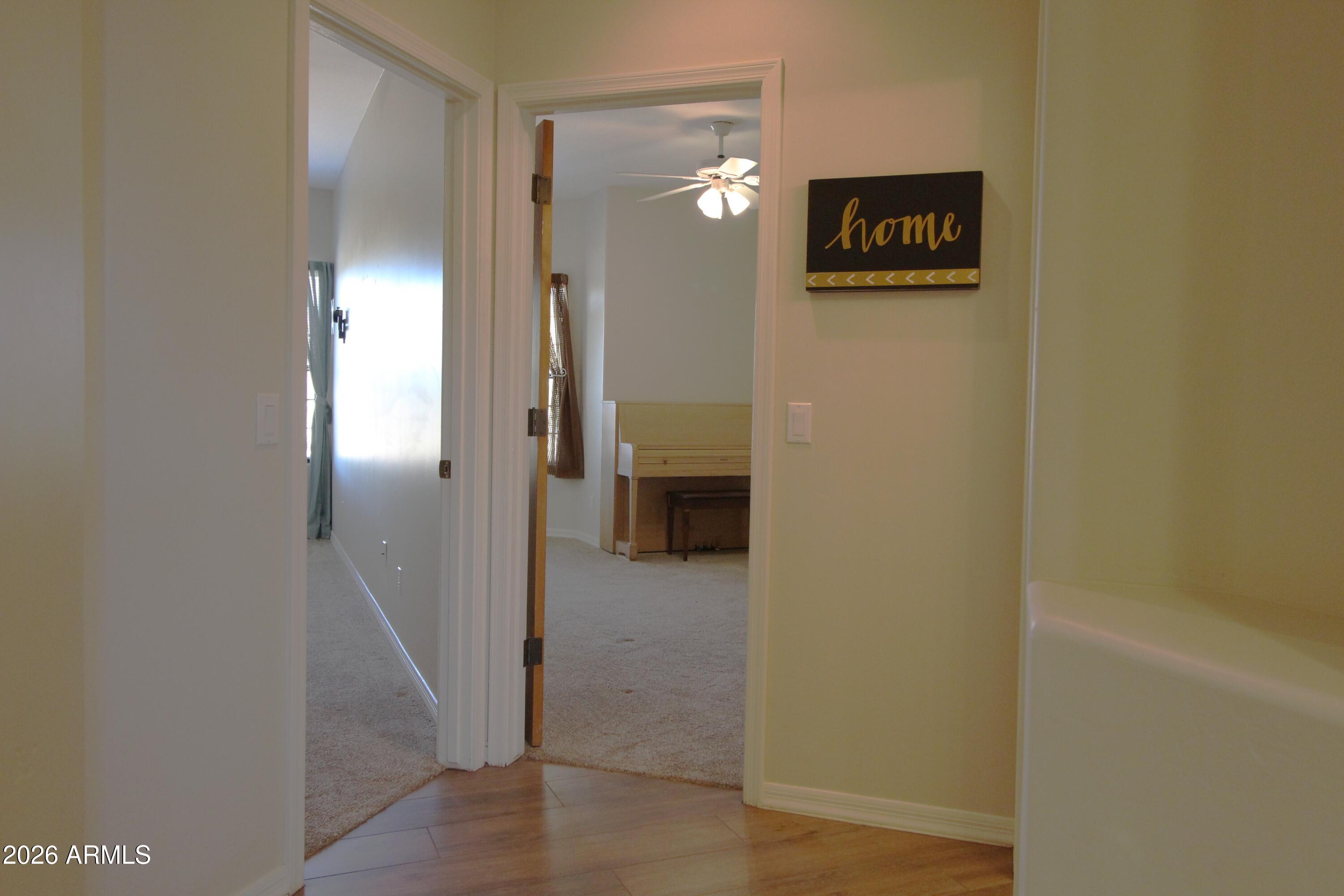 1405 East Circle Mountain Road New River, AZ 85087 - Photo 24 of 40 a view of a hallway with wooden floor