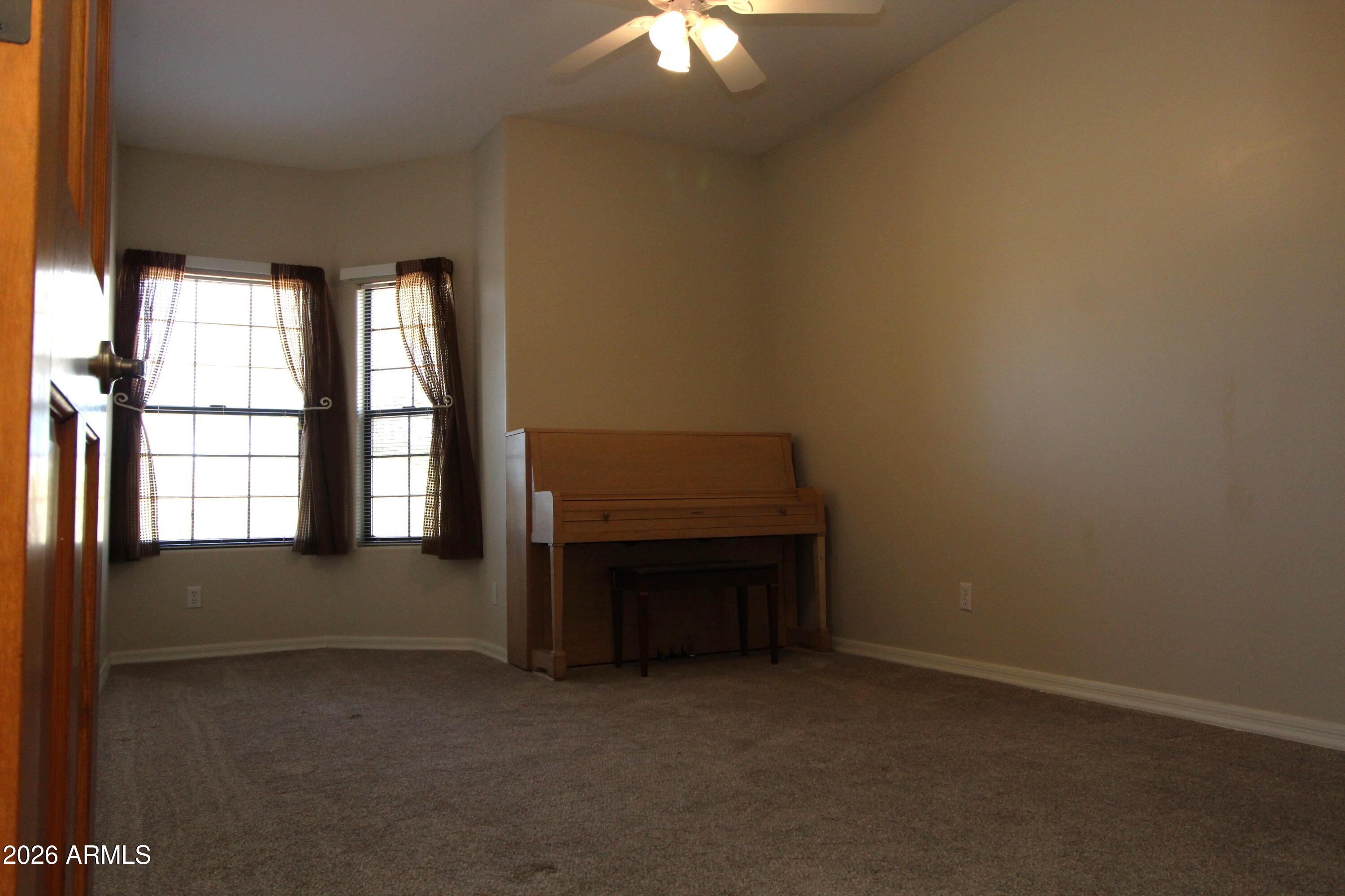 1405 East Circle Mountain Road New River, AZ 85087 - Photo 26 of 40 an empty room with windows and entrance