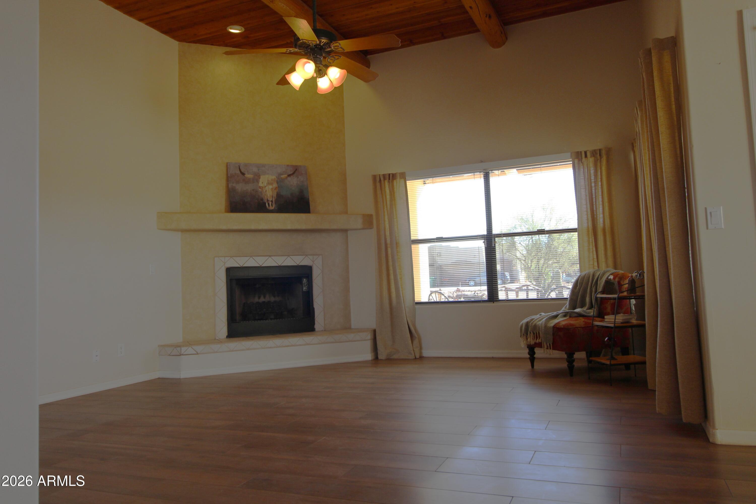 1405 East Circle Mountain Road New River, AZ 85087 - Photo 8 of 40 a living room with furniture and a fireplace