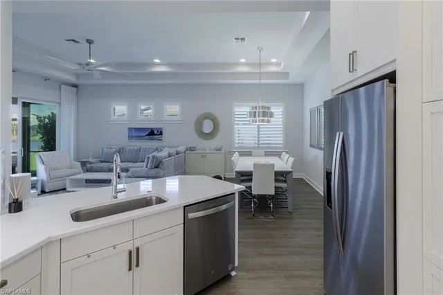 a kitchen with lots of counter space and furniture