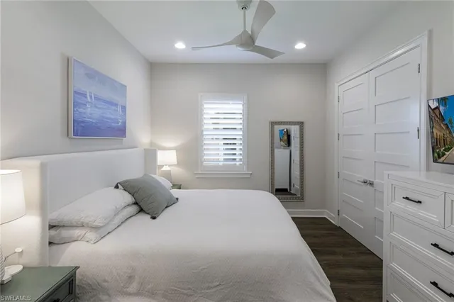 a bedroom with a bed and a walk in closet