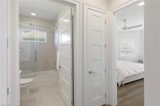 a bathroom with a tub shower and sink
