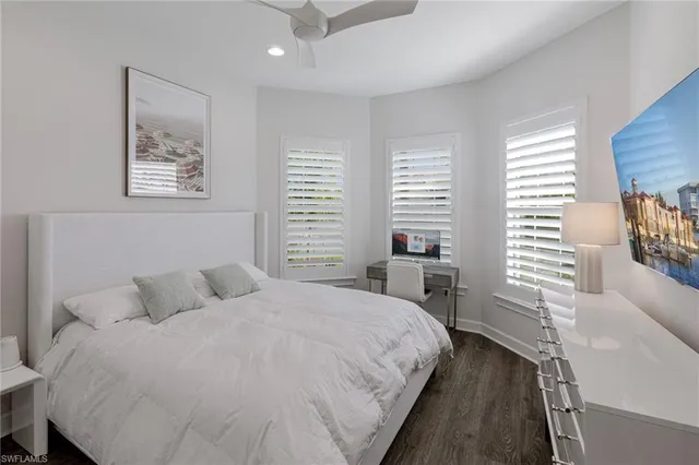 a bedroom with a large bed and a couch