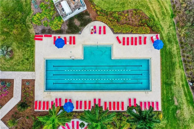 swimming pool with outdoor seating and yard