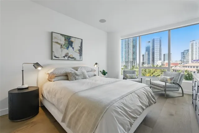 a bedroom with bed and a couch