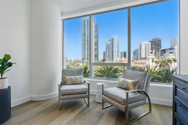 a living room with furniture and a potted plant