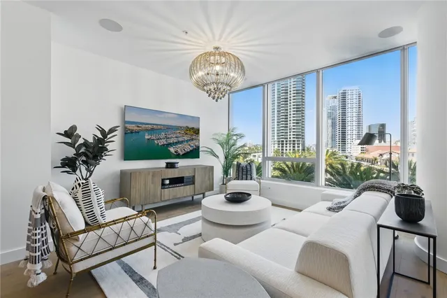 a living room with furniture potted plant and a window