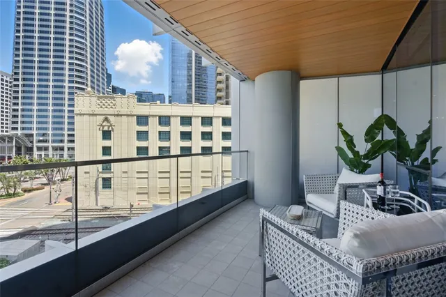 a view of balcony with furniture