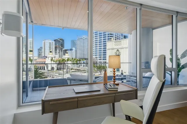 a room with view of kitchen island dining table and chairs