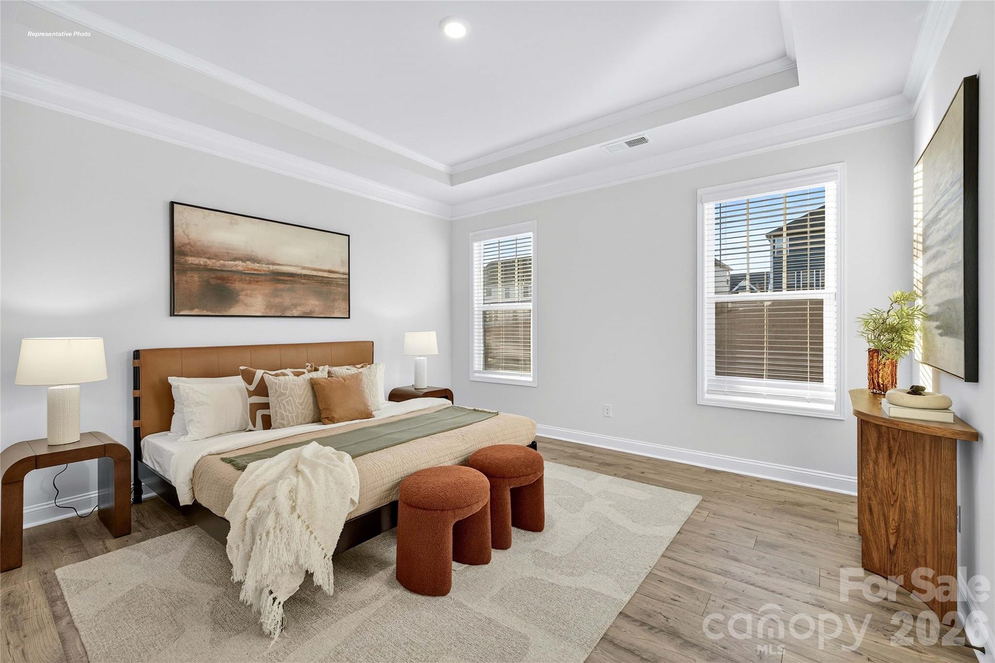 111 Rhuidean Court Troutman, NC 28166 - Photo 14 of 28 a bedroom with a bed and wooden floor