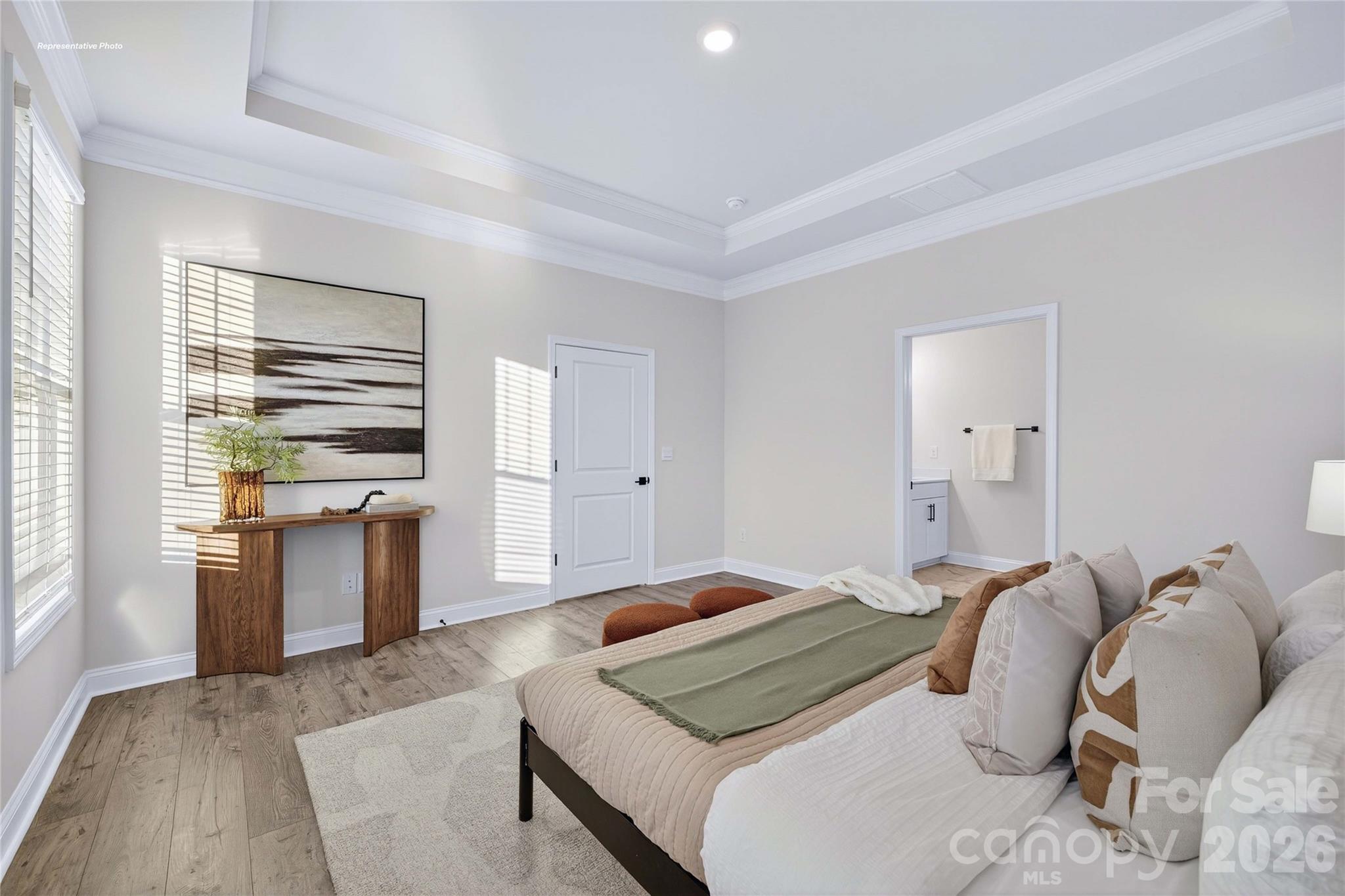111 Rhuidean Court Troutman, NC 28166 - Photo 16 of 28 a bedroom with a bed and a large window