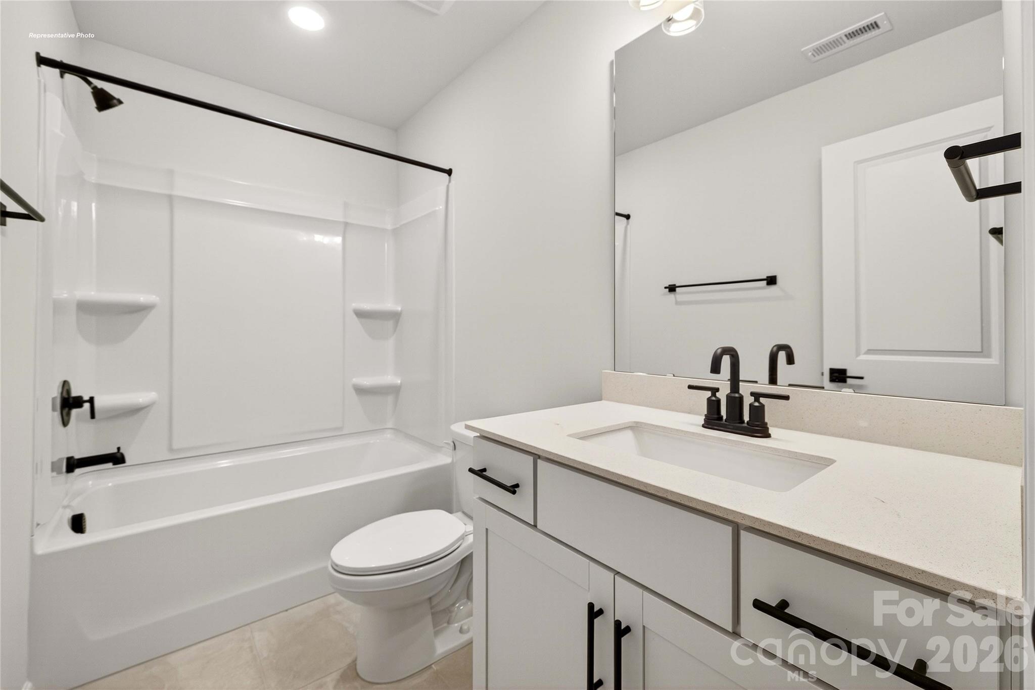 111 Rhuidean Court Troutman, NC 28166 - Photo 27 of 28 a bathroom with a sink toilet vanity and shower