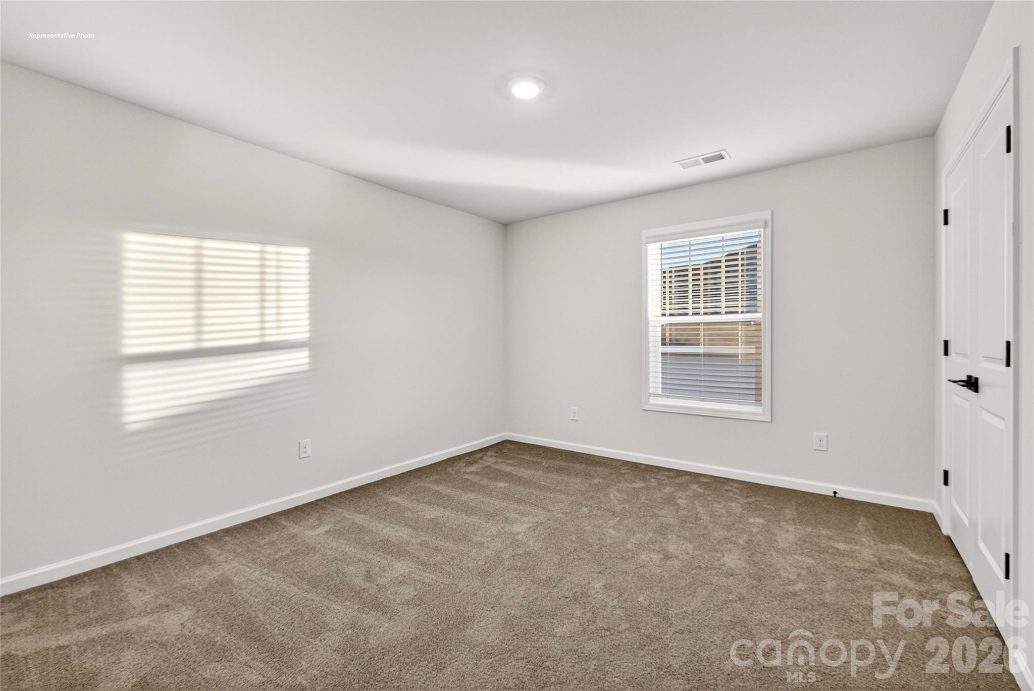 111 Rhuidean Court Troutman, NC 28166 - Photo 28 of 28 an empty room with windows