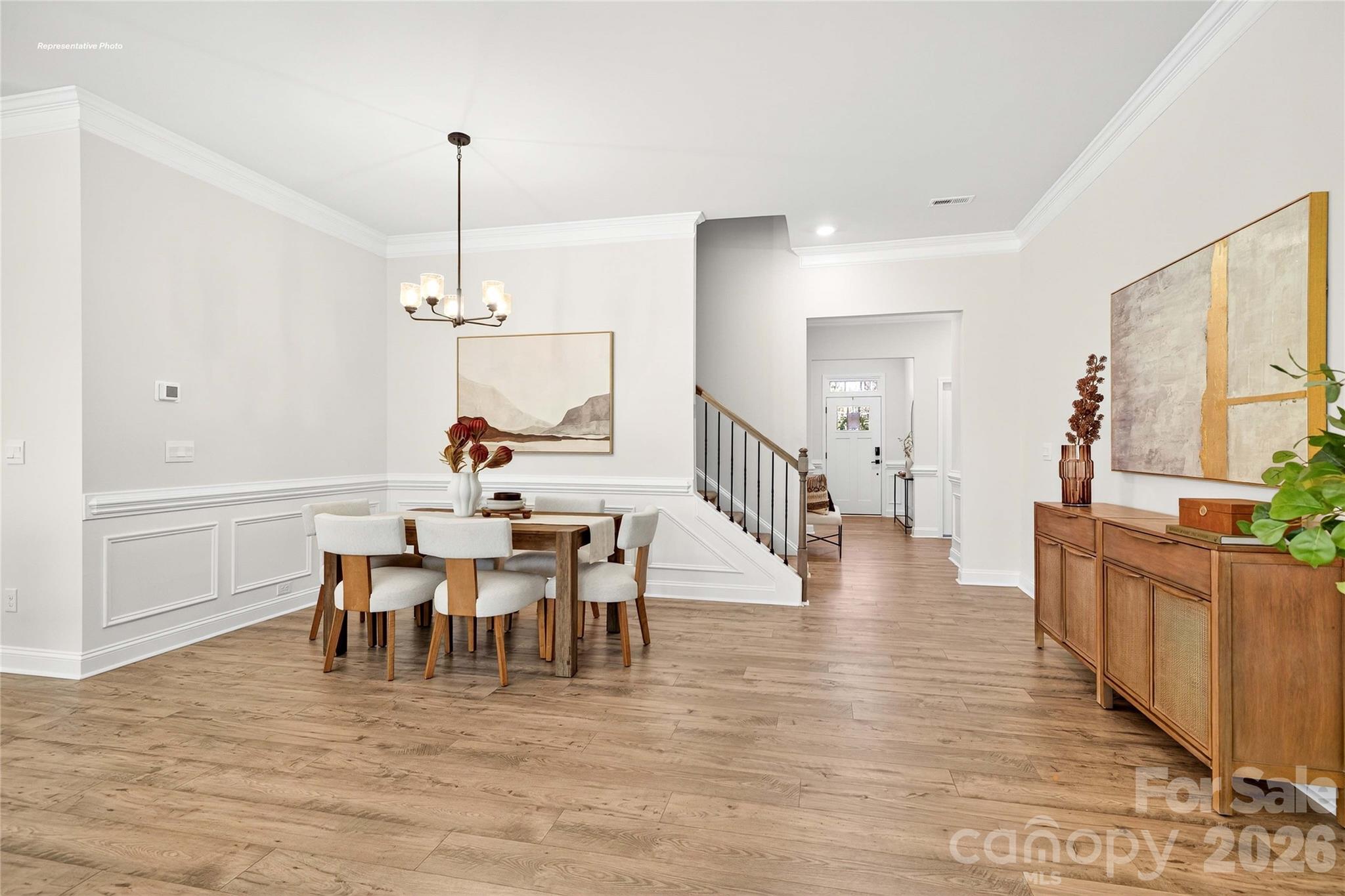 111 Rhuidean Court Troutman, NC 28166 - Photo 3 of 28 a view of a dining room with furniture window and wooden floor