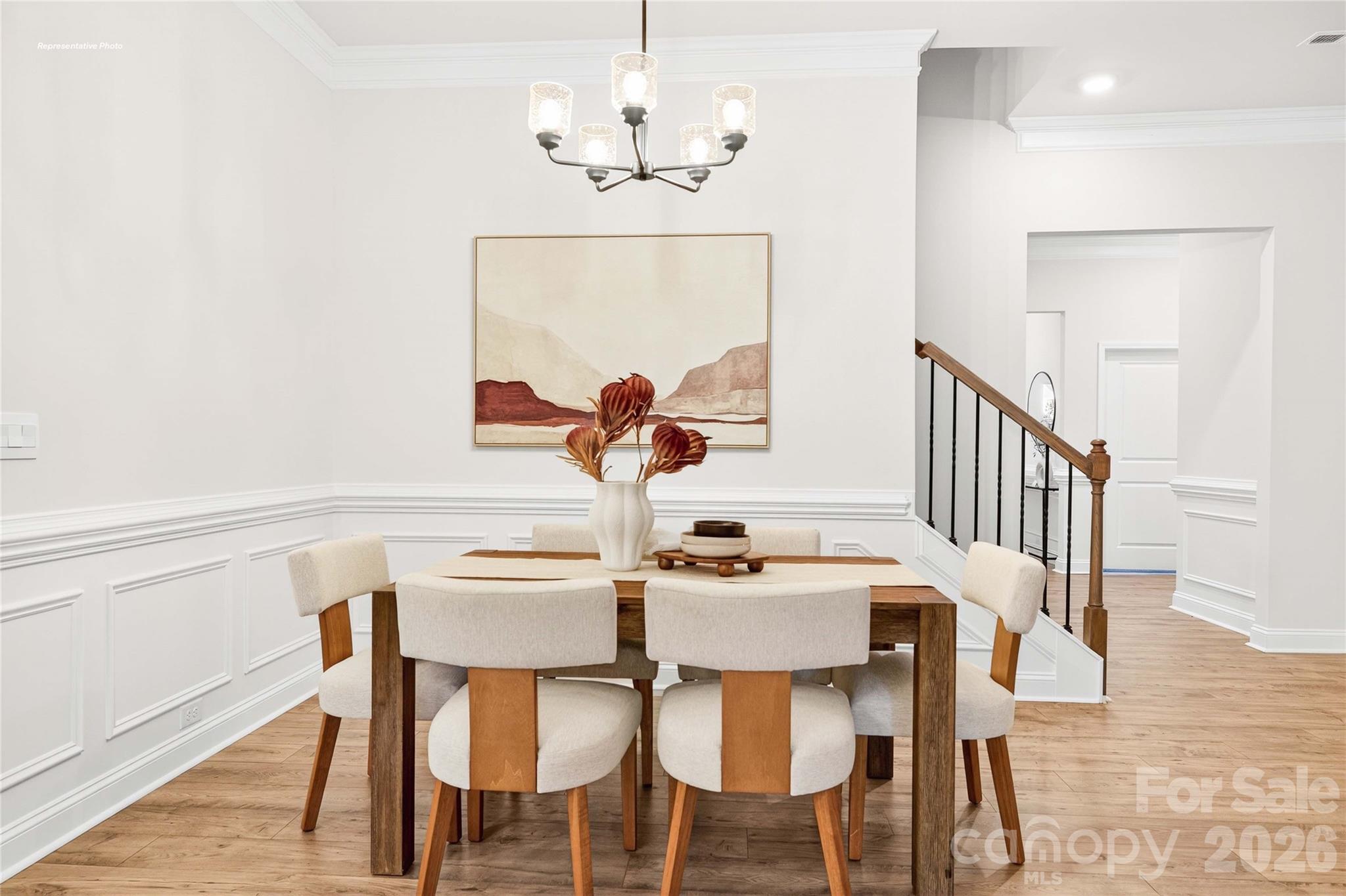 111 Rhuidean Court Troutman, NC 28166 - Photo 4 of 28 a view of a dining room with furniture and a chandelier