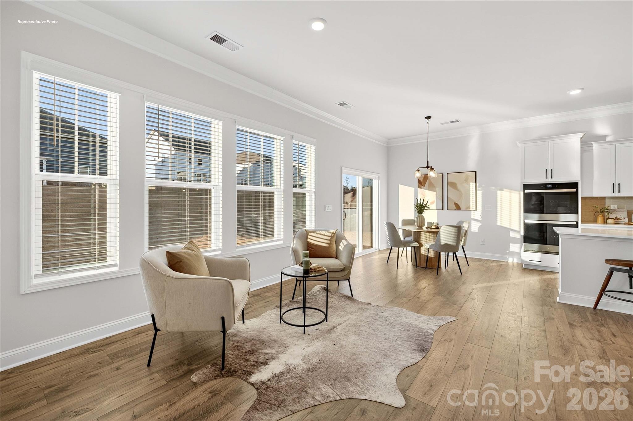 111 Rhuidean Court Troutman, NC 28166 - Photo 8 of 28 a living room with furniture and a large window