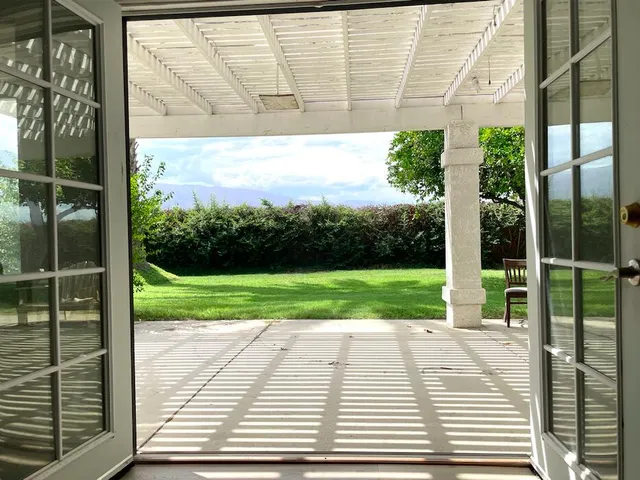 a view of porch with a yard