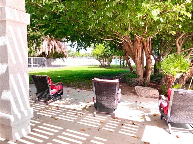 a view of a sitting area with furniture and garden