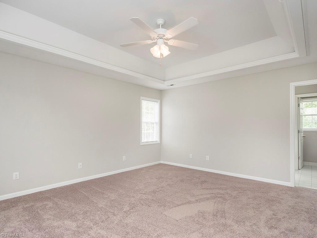 2806 Norwell Court Oak Ridge, NC 27310 - Photo 11 of 30 Large Master Bedroom with Trey ceilings and neutral paint.