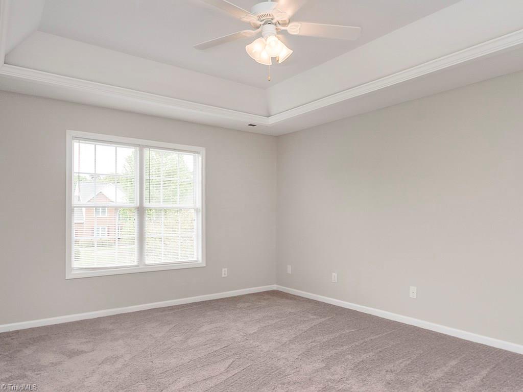 2806 Norwell Court Oak Ridge, NC 27310 - Photo 12 of 30 Ceiling fan in Master Bedroom and Bright Double Window facing the front of the house!