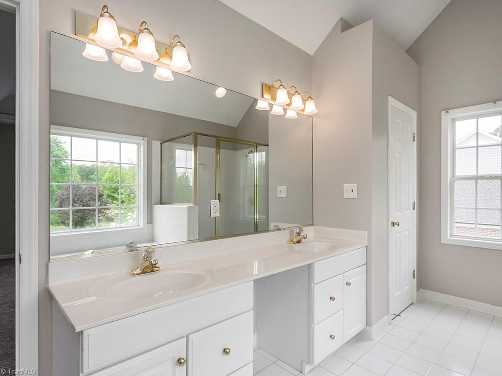 2806 Norwell Court Oak Ridge, NC 27310 - Photo 13 of 30 Oversized Double Vanity in MBR with plenty of storage and closet for plenty of storage!