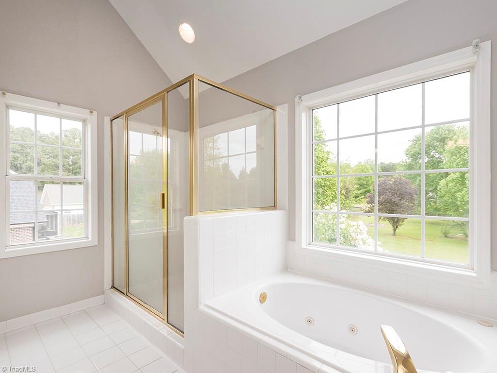 2806 Norwell Court Oak Ridge, NC 27310 - Photo 14 of 30 Separate tiled shower enclosure and Jetted Garden Tub. Vaulted ceilings!
