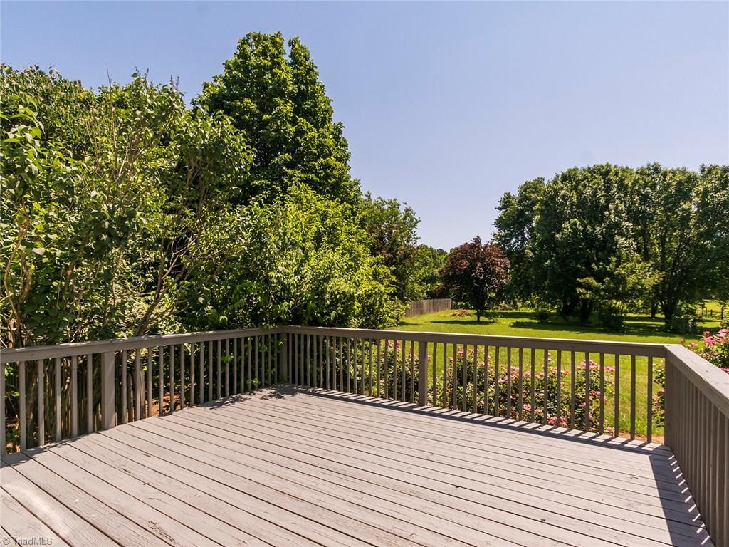 2806 Norwell Court Oak Ridge, NC 27310 - Photo 21 of 30 Large Deck overlooking beautiful flat backyard!