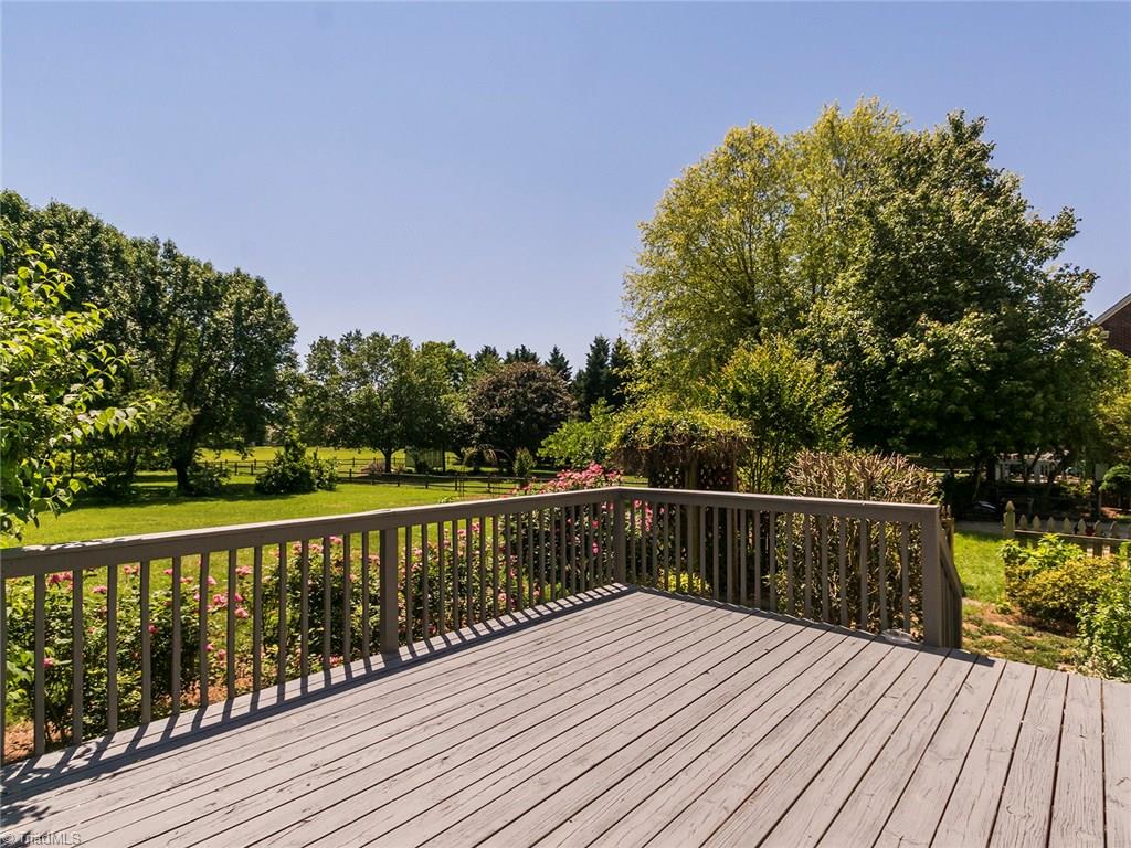 2806 Norwell Court Oak Ridge, NC 27310 - Photo 22 of 30 Serene view from deck of mature landscaping in private backyard!