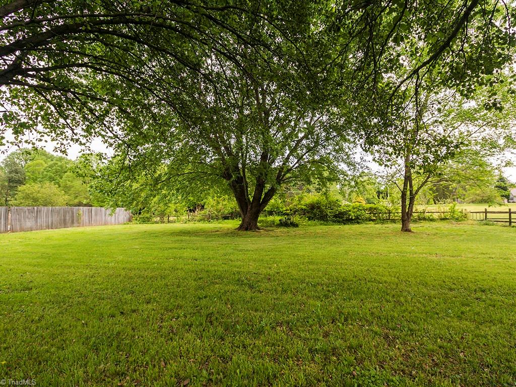 2806 Norwell Court Oak Ridge, NC 27310 - Photo 26 of 30 Beautiful mature trees in the back provide shade great shade!