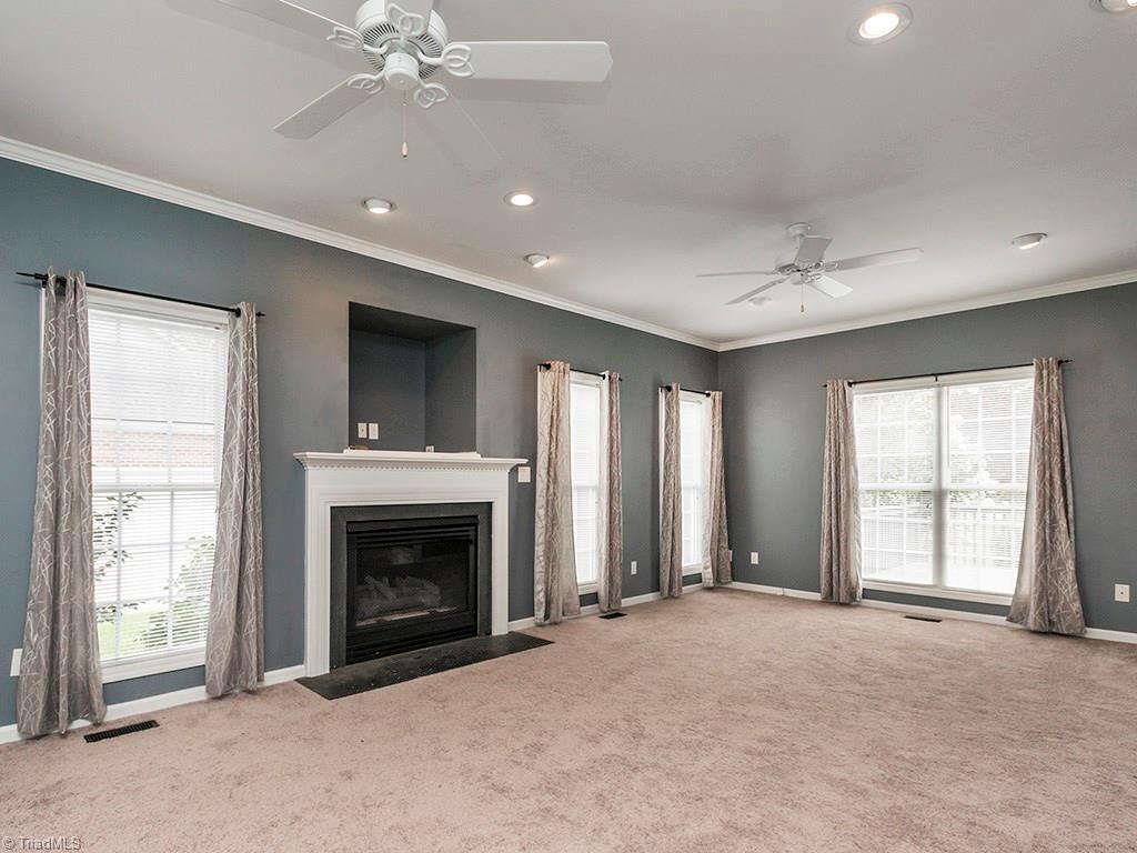 2806 Norwell Court Oak Ridge, NC 27310 - Photo 4 of 30 Huge Great room! Gas fireplace, tons of windows, recessed lighting and ceiling fans!