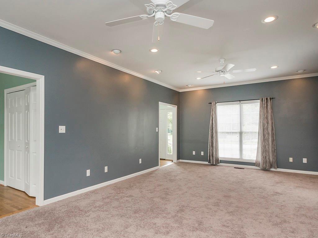 2806 Norwell Court Oak Ridge, NC 27310 - Photo 5 of 30 Cozy carpeted Great Room has plenty of space! Doorway to the left goes into Breakfast Room and Kitchen!