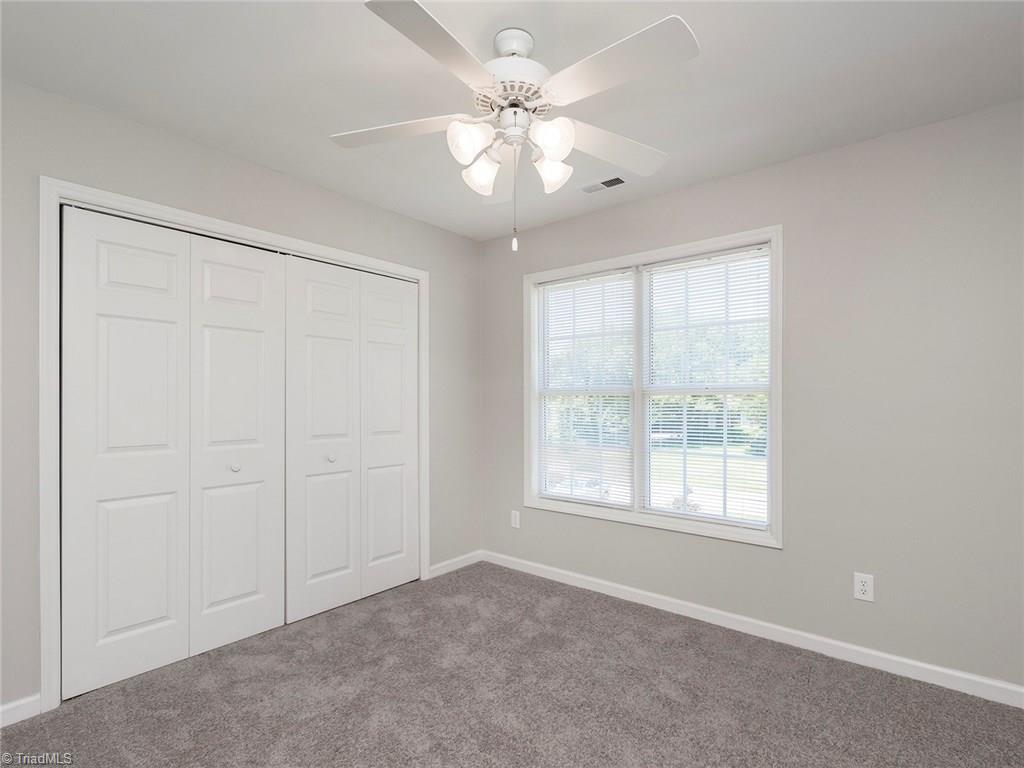 2806 Norwell Court Oak Ridge, NC 27310 - Photo 10 of 30 Second bedroom with oversized closet and ceiling fan!