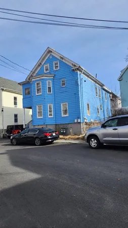 a view of a cars parked in front of a house