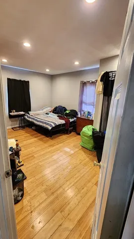 a view of an entryway with wooden floor