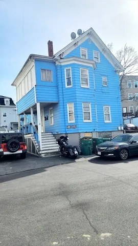 a car parked in front of a house