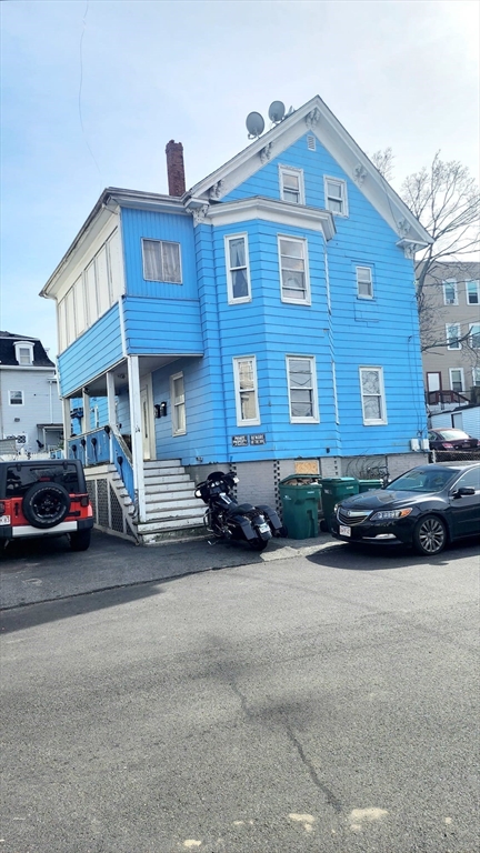 14 Valley Avenue Lynn, MA 01902 - Photo 2 of 16 a car parked in front of a house